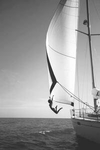 Fotografi Woman jumping from a yacht into the ocean., Mint Images