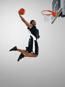 Fotografi Basketball player dunking ball, low angle view, Blake Little