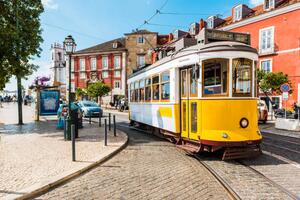 Fotografi Old yellow tram on the streets, © Marco Bottigelli