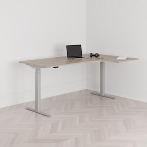 Höj och sänkbart svängt skrivbord, 2-motorigt, högersvängt, grått stativ, ek bordsskiva 180x120cm