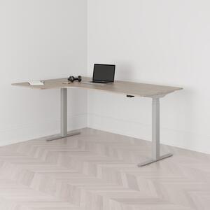 Höj och sänkbart svängt skrivbord, 2-motorigt, vänstersvängt, grått stativ, ek bordsskiva 180x120cm