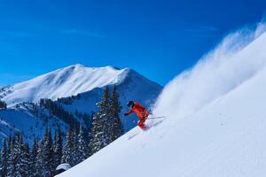 Fotografi Man skiing down steep snow covered, Jakob Helbig