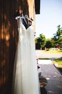 Konstfotografering Beautiful white wedding dress hanging elegantly, Wirestock, (26.7 x 40 cm)