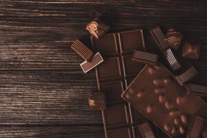 Fotografi Chocolate bars with nuts and candies close-up., Olena Ruban, (40 x 26.7 cm)