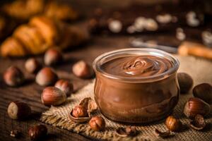 Fotografi Crystal jar full of hazelnut and chocolate spread, carlosgaw, (40 x 26.7 cm)