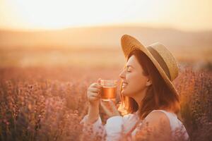 Konstfotografering Young happy woman drinking herbal tea,, Polina Lebed, (40 x 26.7 cm)