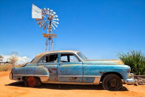 Illustration Abandoned vintage car in the desert, Bim