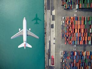 Illustration Airplane flying over container port, Orbon Alija