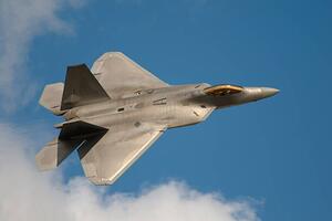 Fotografi F22 Raptor Jet Fighter flying in the sky, JohnnyPowell