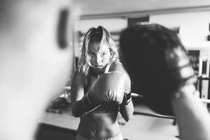 Fotografi Woman boxer workout with coach, massimo colombo