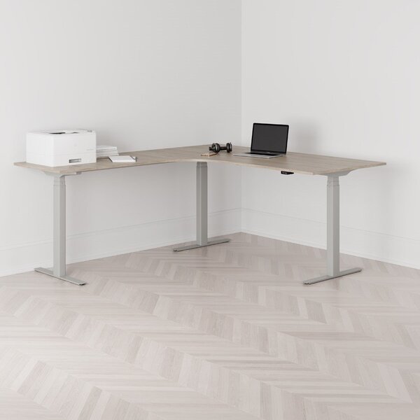 Höj och sänkbart hörnskrivbord, vänstersvängt, grått stativ, ek bordsskiva 180x200cm
