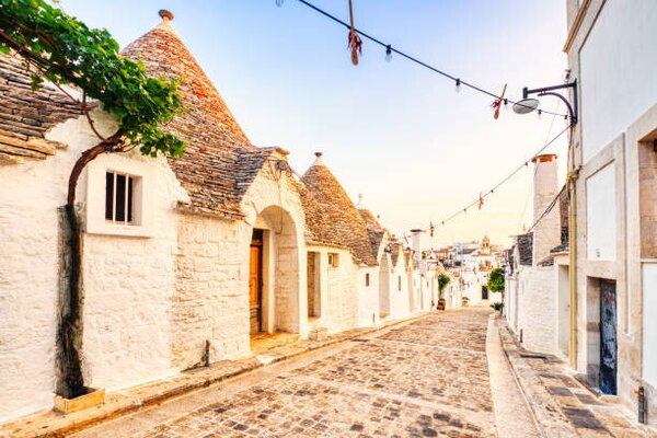 Fotografi Famous Trulli Houses during a Sunny, roman_slavik